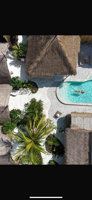 an aerial view of a resort with a swimming pool at Sayamaya - Soft Opening in Gili Islands