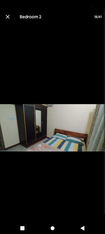 Ένα ή περισσότερα κρεβάτια σε δωμάτιο στο PARK VIEW In MYSORE CITY