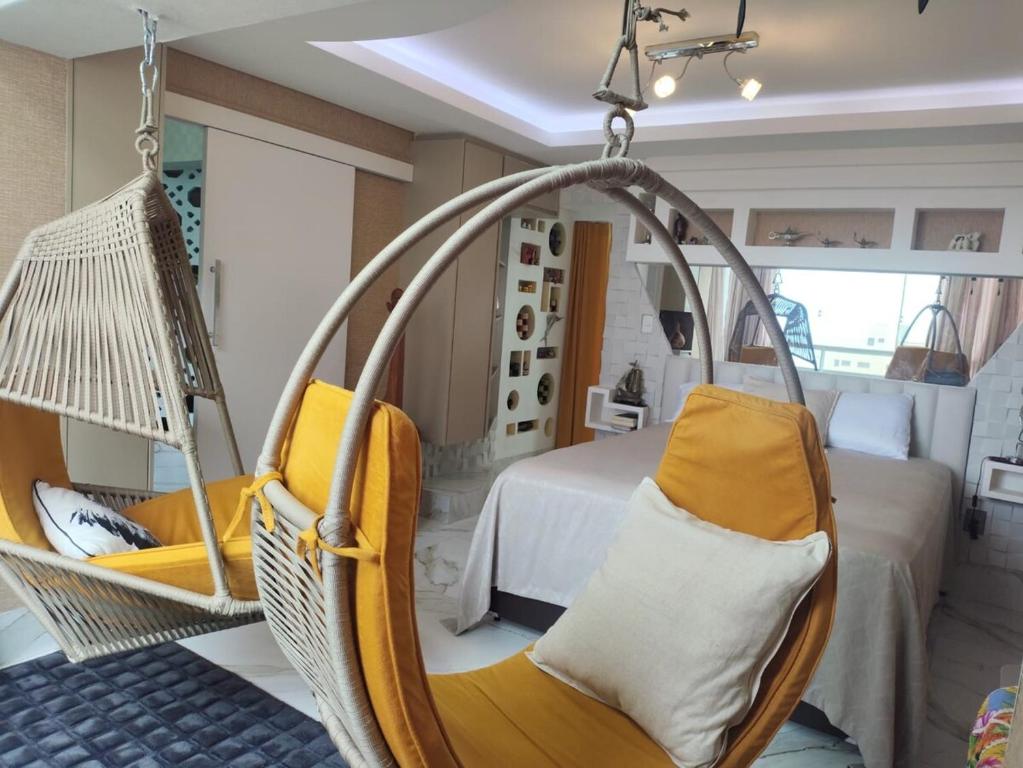a bedroom with a swing and a bed at Avenida Brasil, Balneário Camboriú in Balneário Camboriú