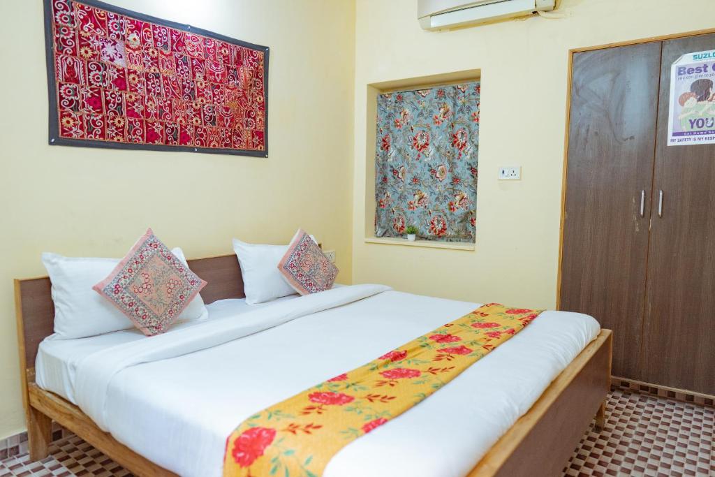 a bedroom with a large bed in a room at Hotel Rumis Jaisalmer & Safari in Jaisalmer