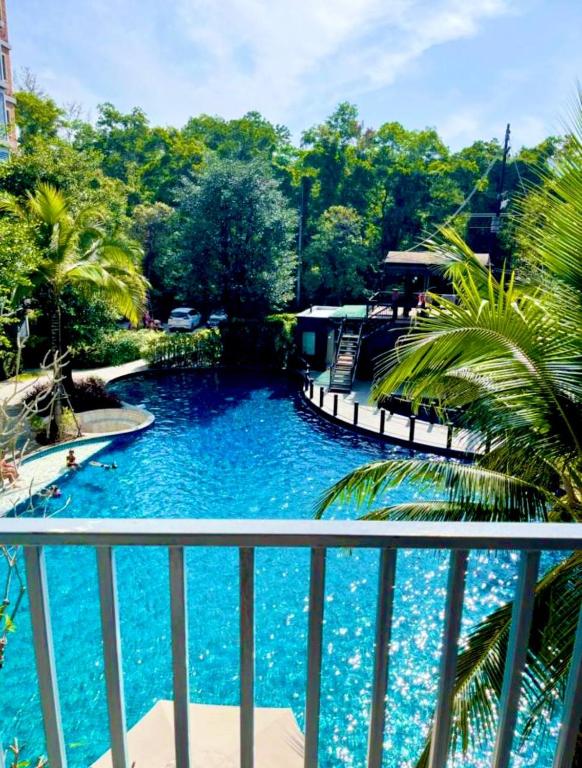 a view of a swimming pool from a balcony at naiyang beach in Phuket