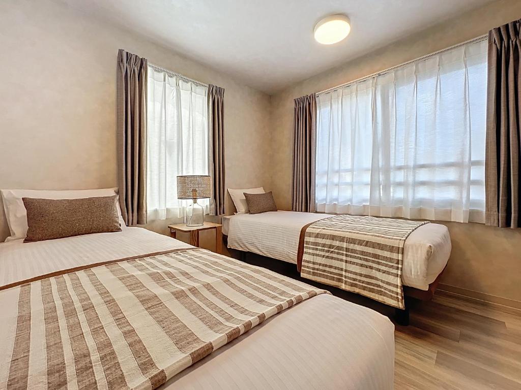 Ένα ή περισσότερα κρεβάτια σε δωμάτιο στο Viento Ikebukuro