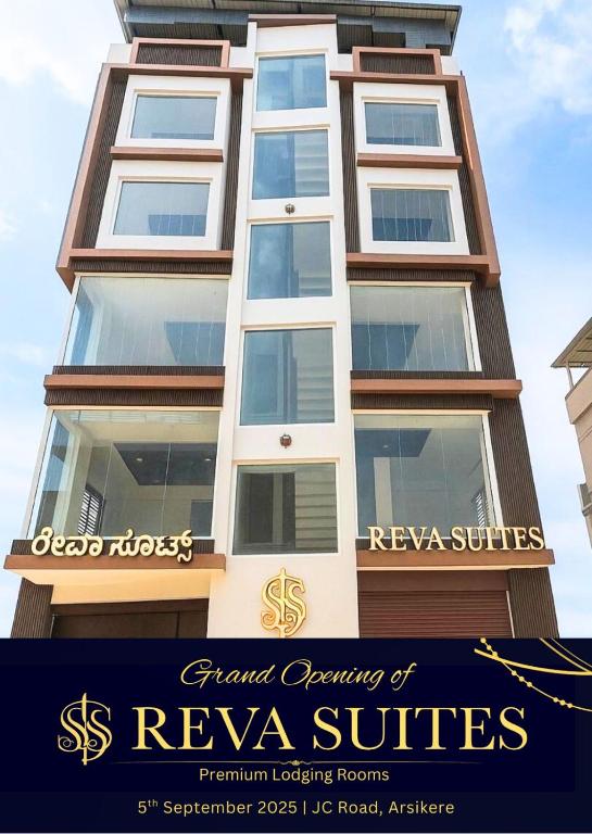 a building with the words grand opening of revya suites at Reva suites in Arsikere