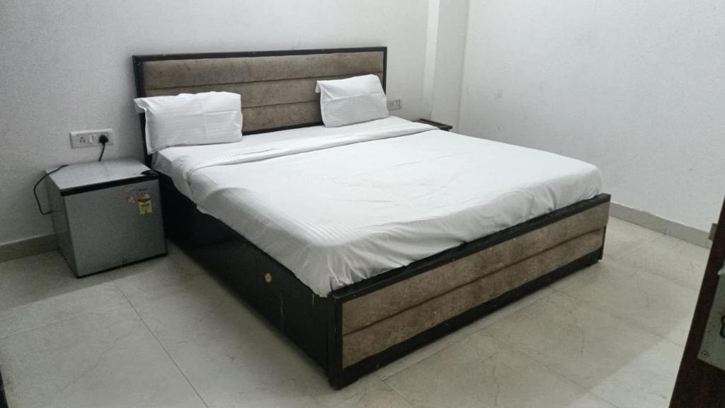 Ένα ή περισσότερα κρεβάτια σε δωμάτιο στο SKY Inn by Twamev