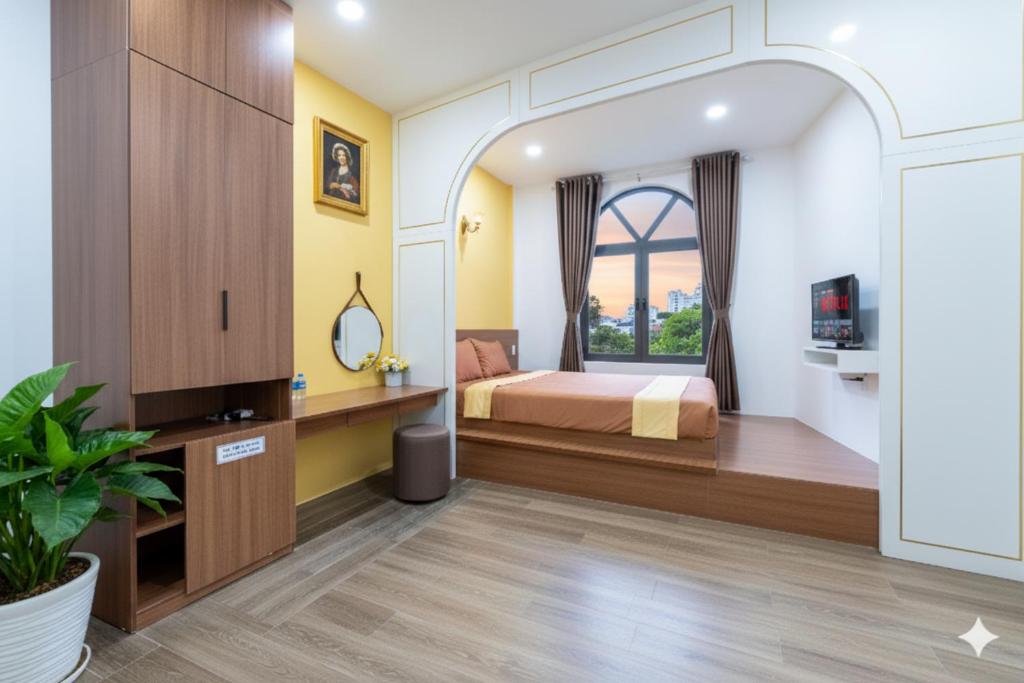 a bedroom with a bed and a window at Yo'House Hue Homestay in Hue