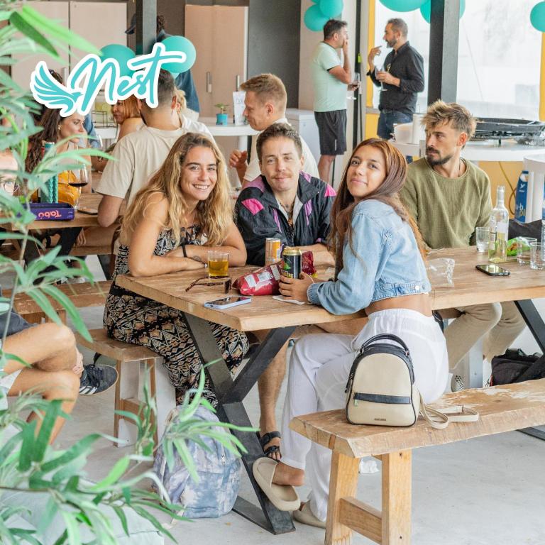 a group of people sitting at tables in a restaurant at Las Eras Nest Hostel in Las Eras