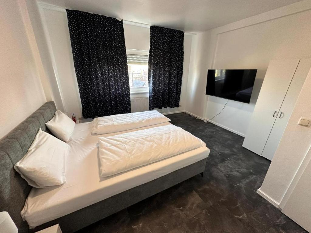 Ένα ή περισσότερα κρεβάτια σε δωμάτιο στο Alfa Hotel Frankfurt