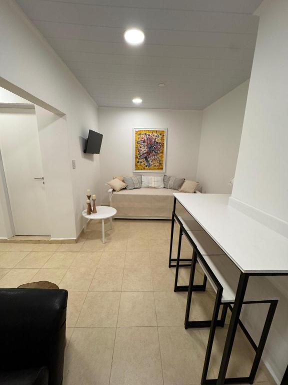 a living room with a couch and a table at Don Antonio Apart 2 in Resistencia