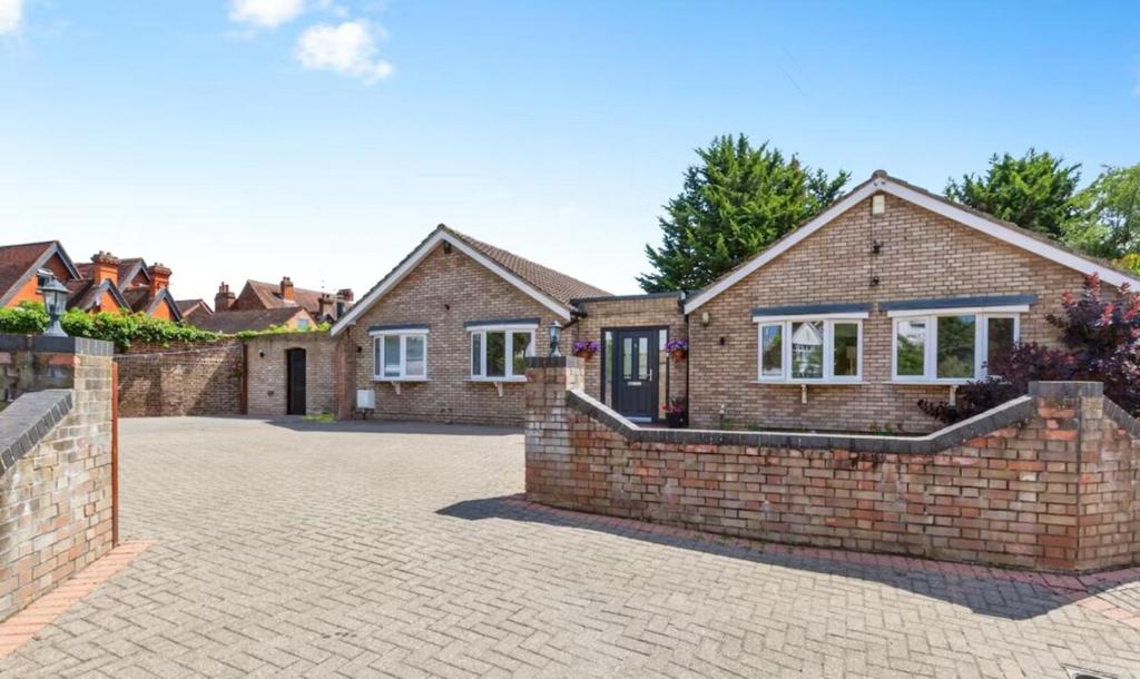 a brick house with a brick driveway at Windsor Reach in Datchet
