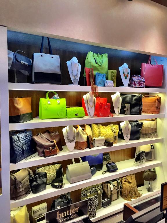 a shelf filled with different types of purses and handbags at Golden Nugget Biloxi in Biloxi