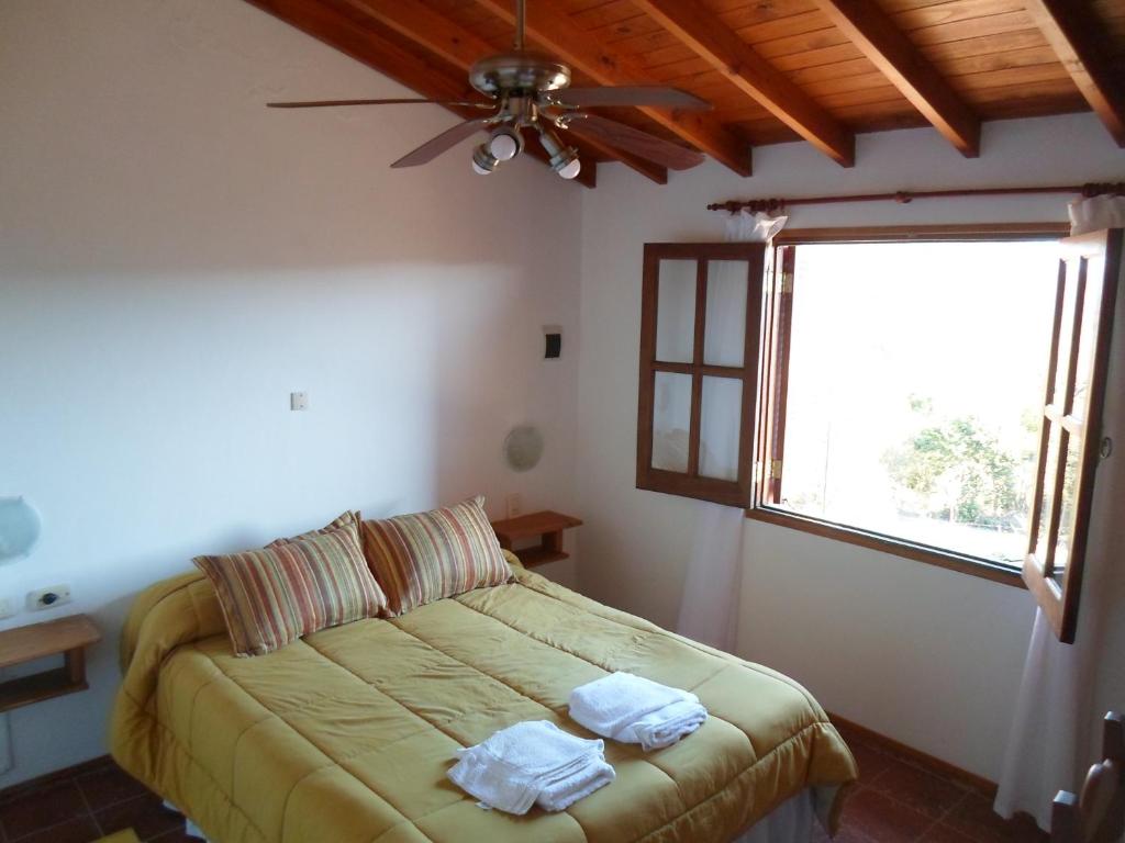 Ένα ή περισσότερα κρεβάτια σε δωμάτιο στο DeRoxy Village