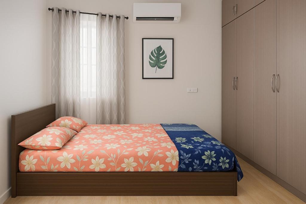 a bedroom with a bed and a cabinet at Bhakti Bliss Homestay - New Luxury 2bhk apartment in Tirupati with Kitchen and car parking in Tirupati