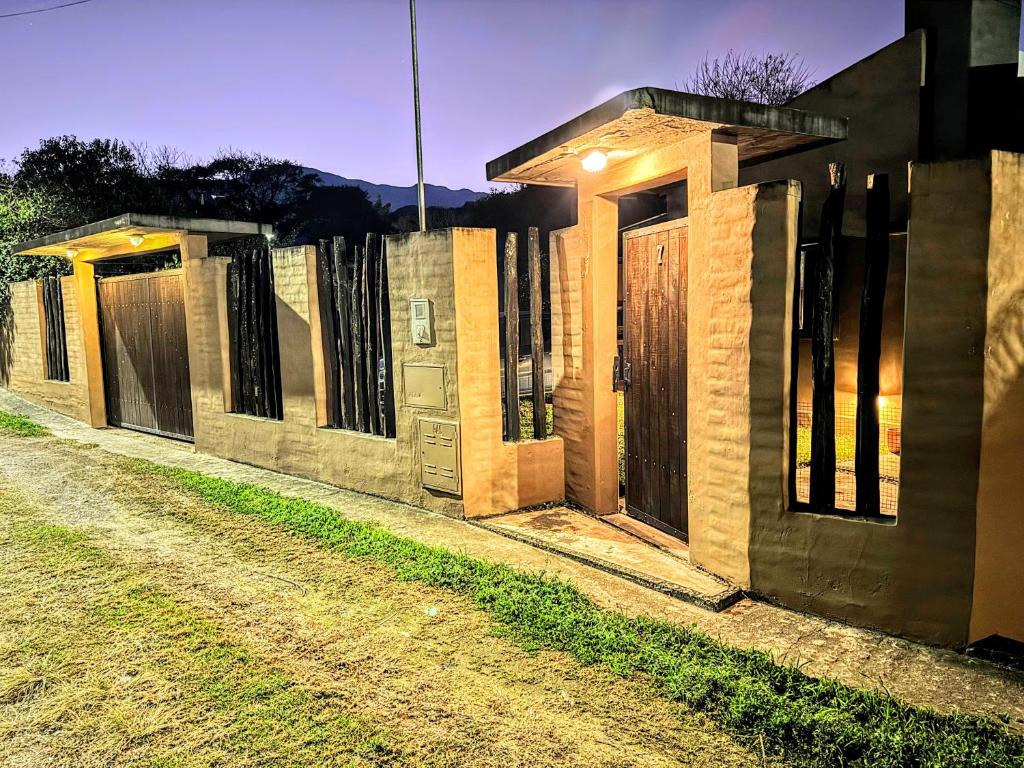 una fila de casas con puertas de madera en una calle en House in Yala - close to La Quebrada, en Yala