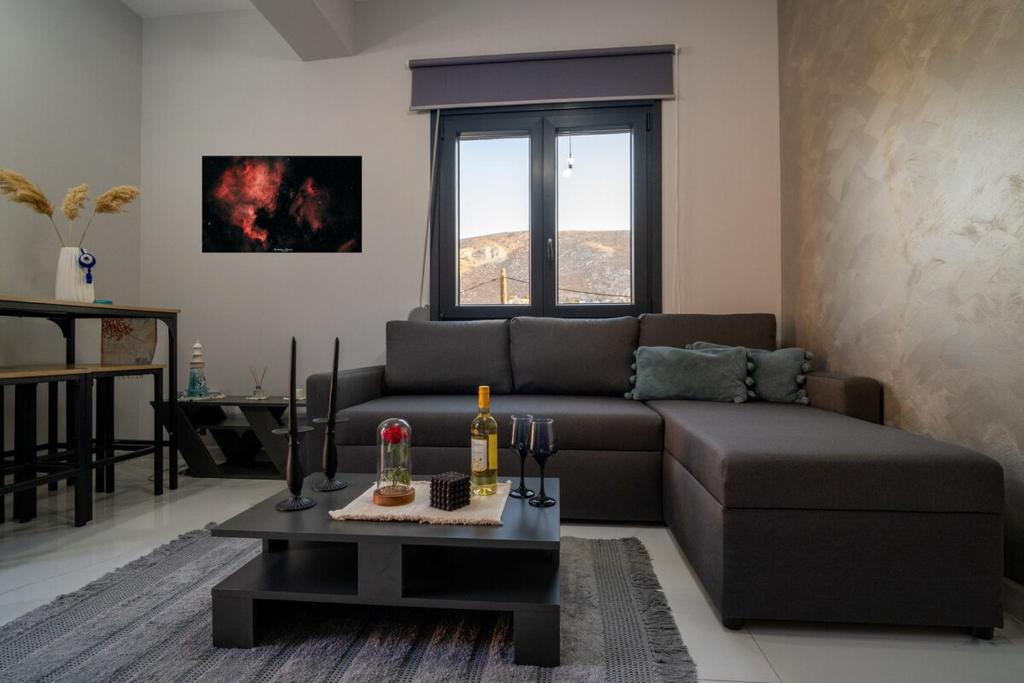 a living room with a couch and a table at Luna in Kalymnos