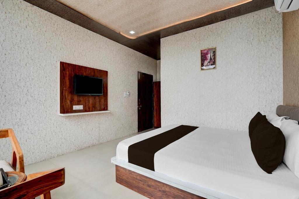 Ένα ή περισσότερα κρεβάτια σε δωμάτιο στο Hotel O Asthara