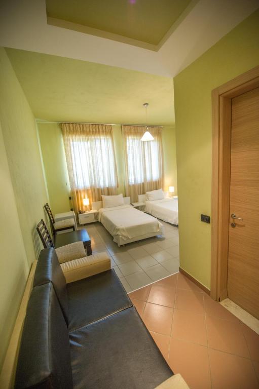 Postel nebo postele na pokoji v ubytování Luani A Hotel