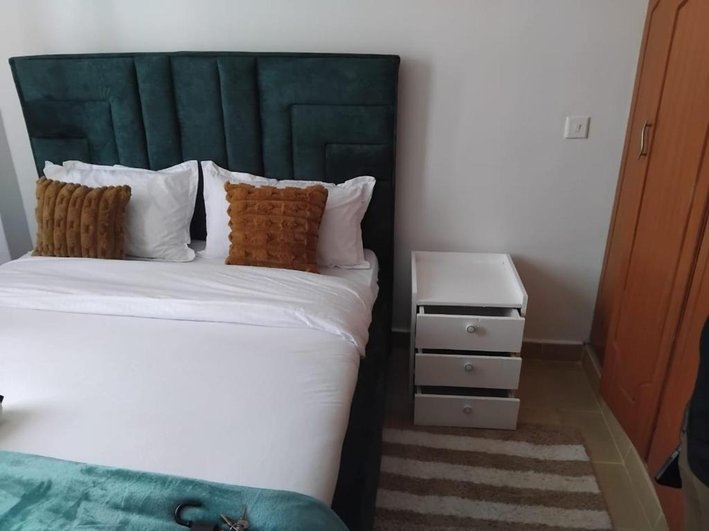 Ένα ή περισσότερα κρεβάτια σε δωμάτιο στο LORA'S Haven Homes Kisii - 2 bedroom