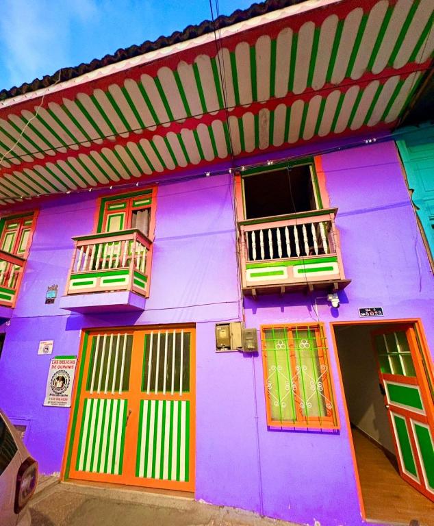 a colorful building with colorful doors and windows at Hermosa casa en el centro de Filandia, Quindío in Filandia