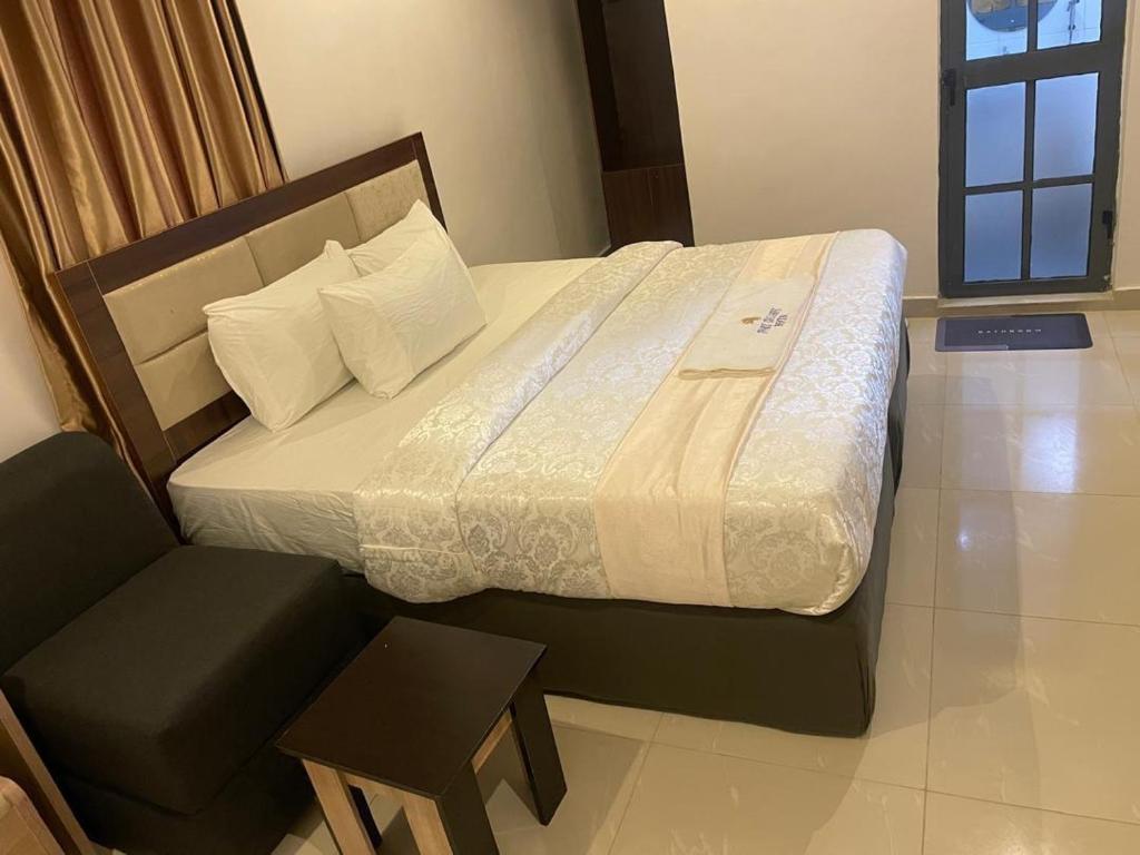 Ένα ή περισσότερα κρεβάτια σε δωμάτιο στο IVORY EXCLUSIVE HOTEL AND SUITEs