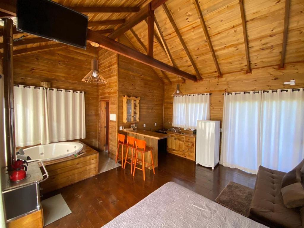 Voodi või voodid majutusasutuse Cabanas Sol e Lua com jacuzzi e vista para as montanhas em Urubici toas