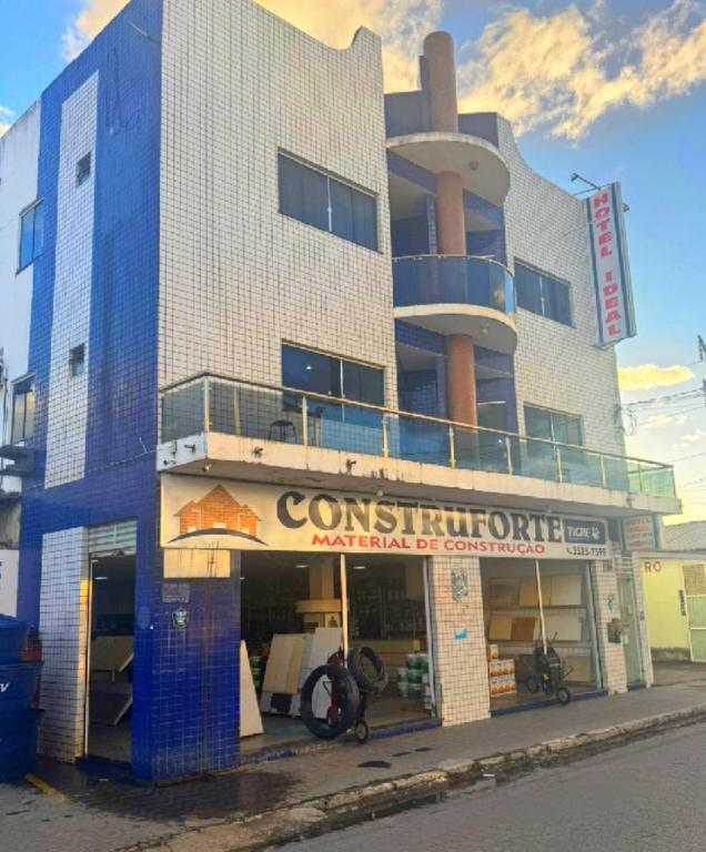 a large building with a restaurant in front of it at Hotel Ideal in Jequié