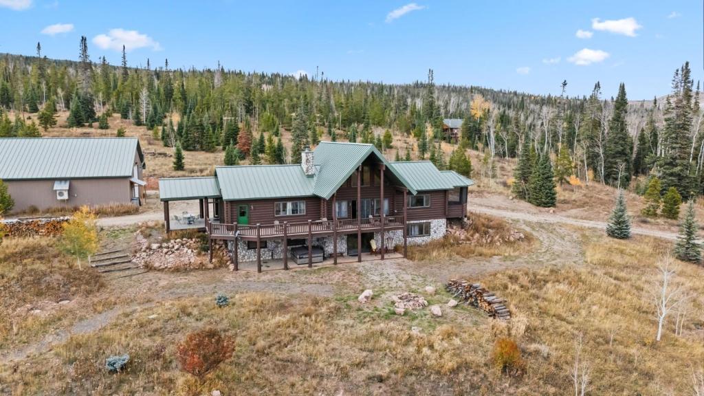 an aerial view of a log home in the mountains at 2665 Golden Edge Drive in Kremmling