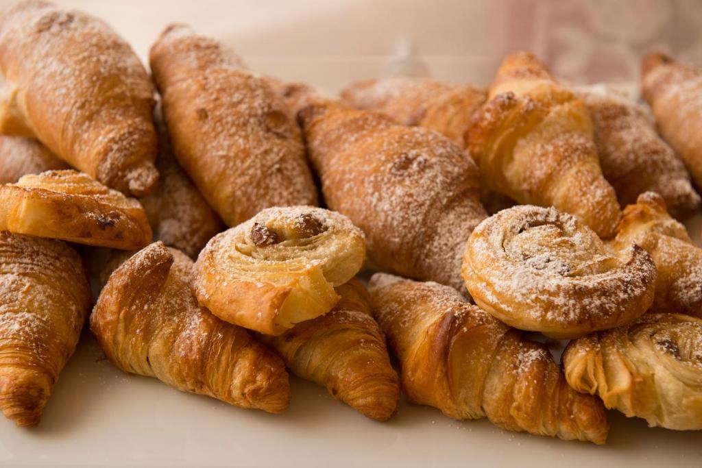 a pile of pastries sitting on a table at Palazzo Indelli in Monopoli