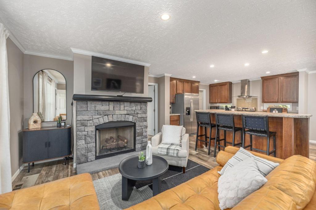 a living room with a couch and a fireplace at Private Retreat by the Ecusta Trail and Downtown in Horse Shoe