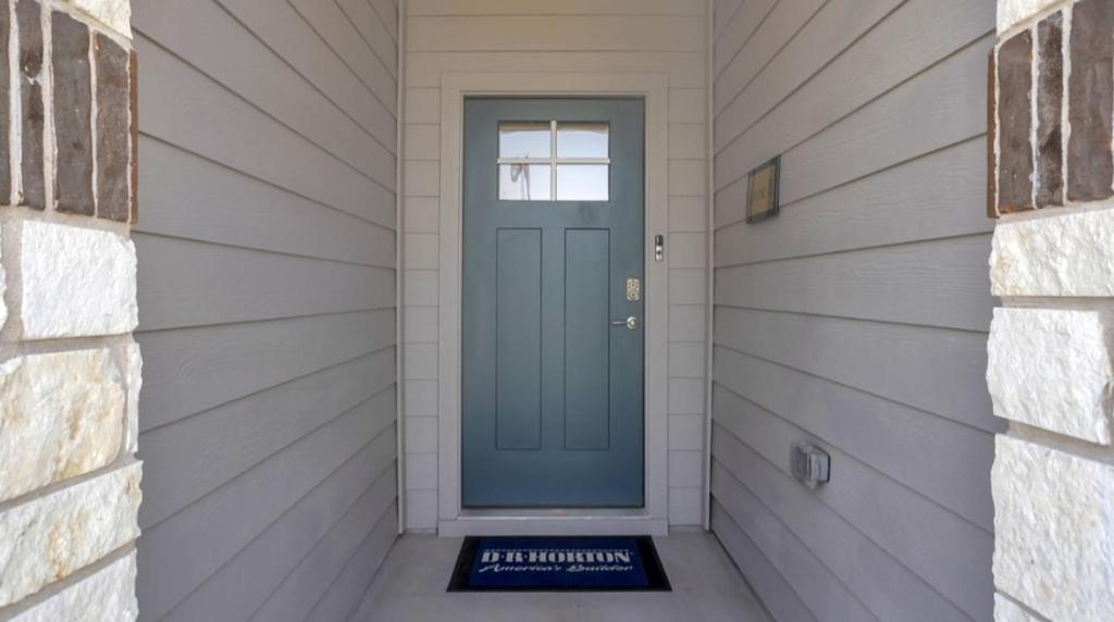 a door in a house with a sign in front at Peaceful Room in Austin in Austin