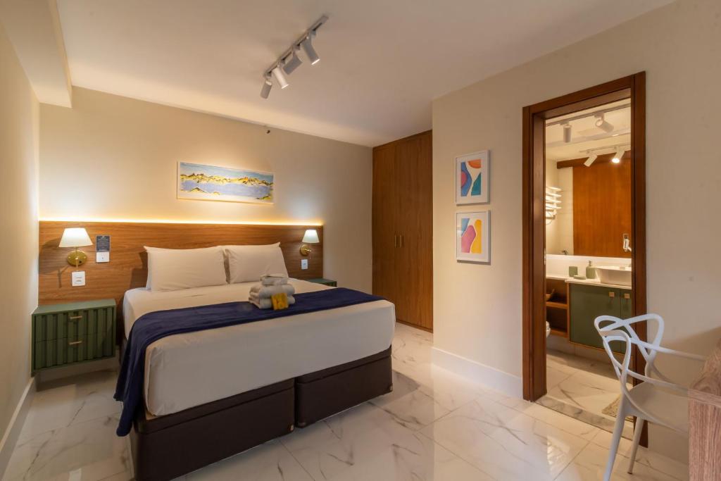 a bedroom with a bed with a teddy bear on it at 6 minutos da Praia do Leblon - GSM103 in Rio de Janeiro