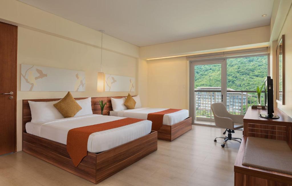 Postel nebo postele na pokoji v ubytování Pico Sands Hotel