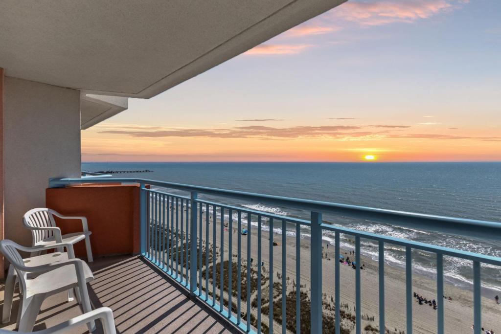 a balcony with two chairs and a view of the ocean at Roxanne Towers Penthouse 6 - Oceanfront in Myrtle Beach
