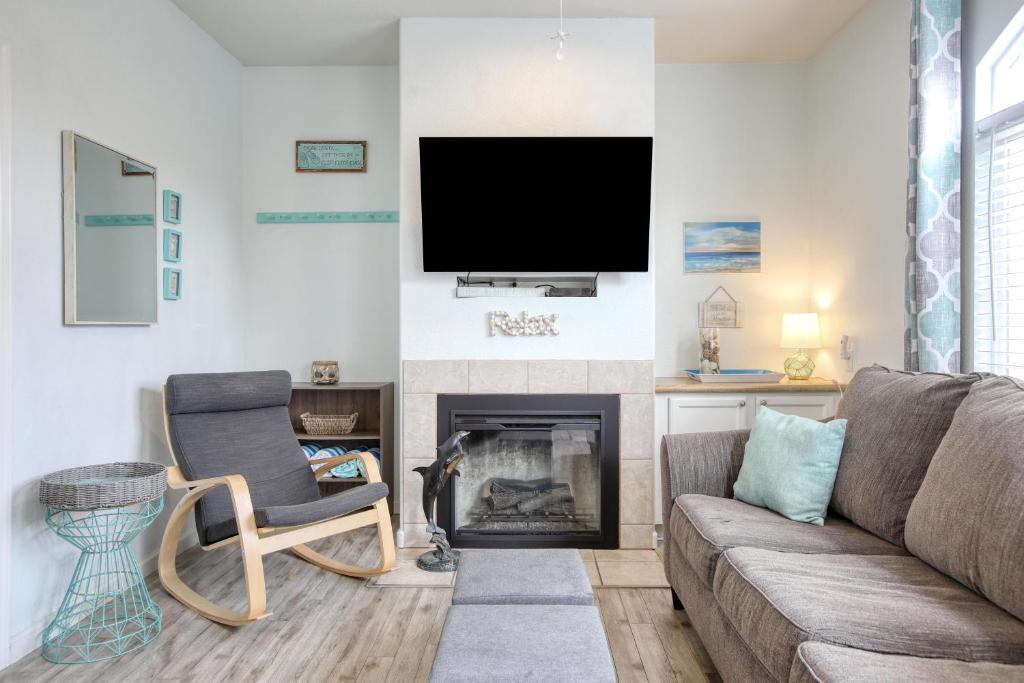 a living room with a couch and a fireplace at Pacific Plaza #608 - Oceano Getaway - 1BdrmUp-K-QSofa in Oceano