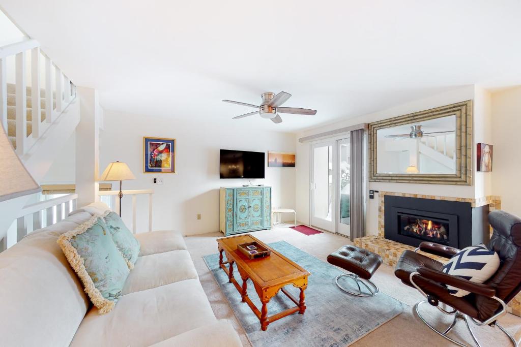 a living room with a couch and a fireplace at Valley Gem Upper in Elkhorn Village