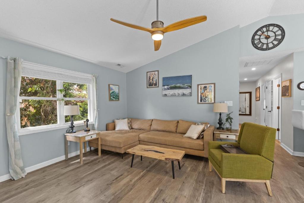 a living room with a couch and a ceiling fan at Whaley Good Livin in Bogue