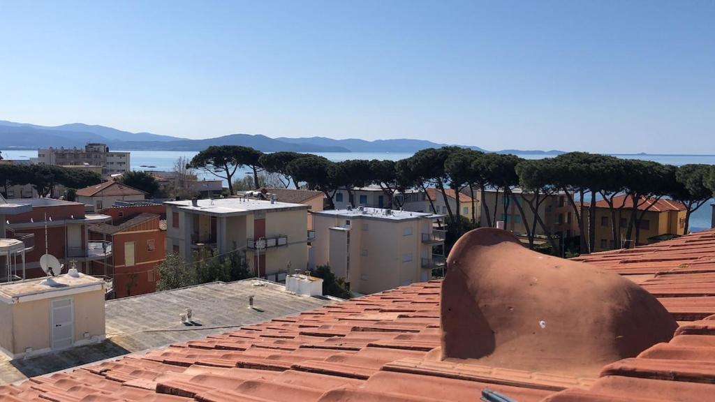 a view of a city from the roof of a building at Lovely apartment near the beach in Follonica