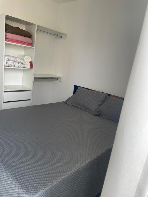 Postel nebo postele na pokoji v ubytování Residencial dos Reis