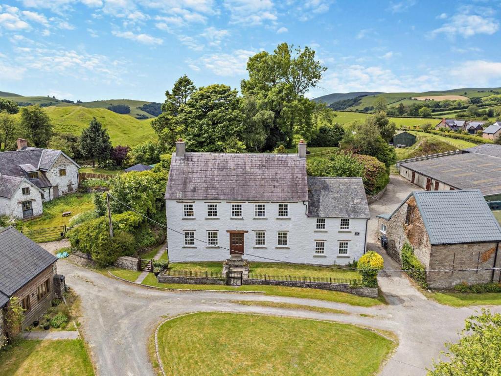 an estate in the hills with a white house at 9 Bed in Hay-on-Wye 73069 in Painscastle