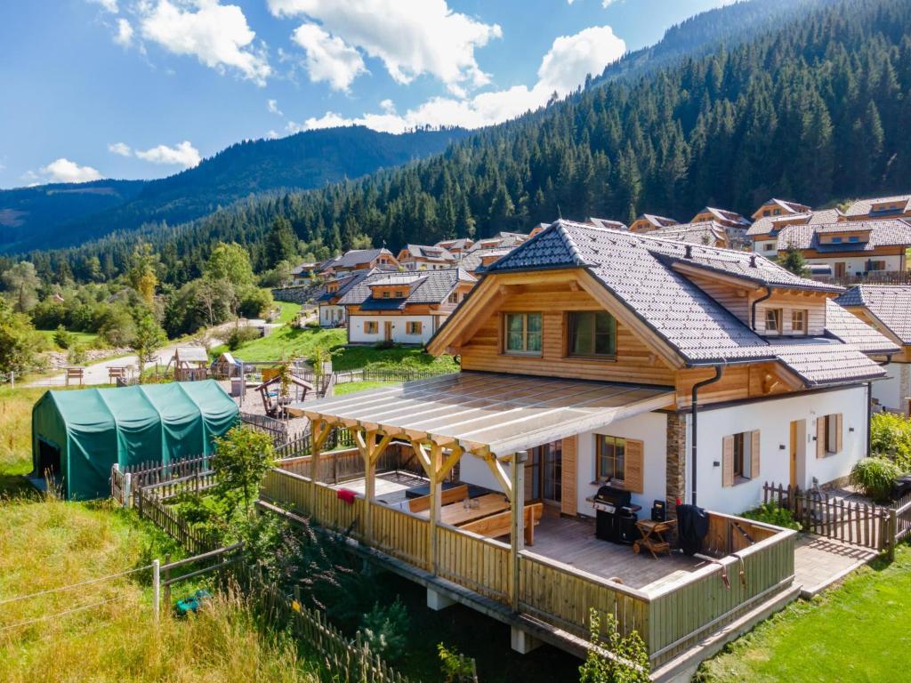 a house in the mountains with a deck at Chalet Thor in Donnersbachwald