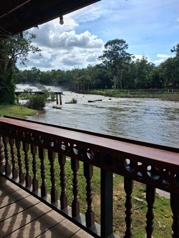 a view of a river from a balcony at Sipasert Guesthouse-Tadlo in Tad Lo