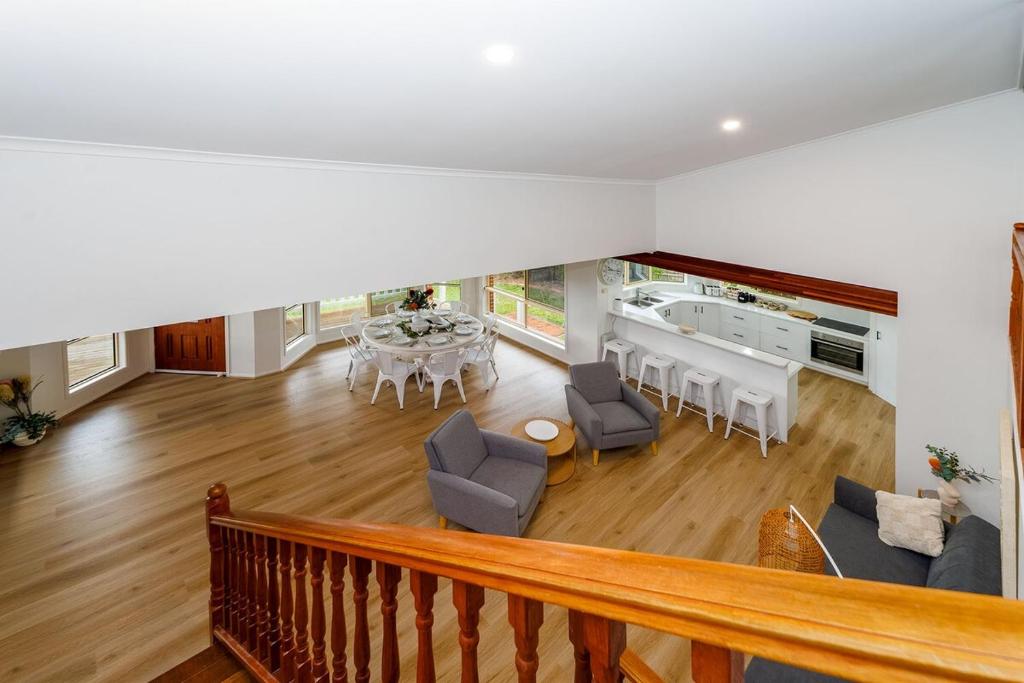 an overhead view of a living room with a table and chairs at Scarness Spacious Home with Pool in Scarness