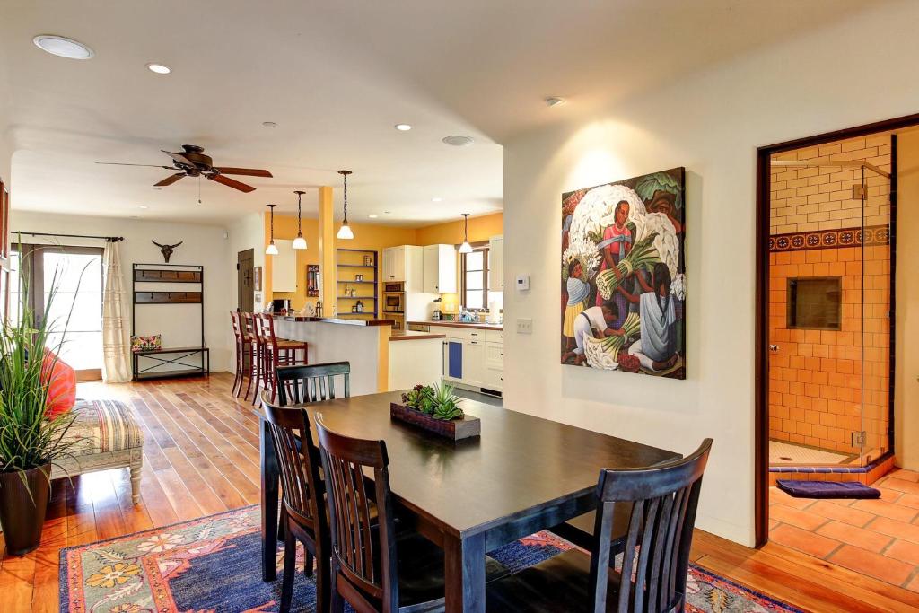 a kitchen and dining room with a table and chairs at West Beach Villa 5 in Santa Barbara