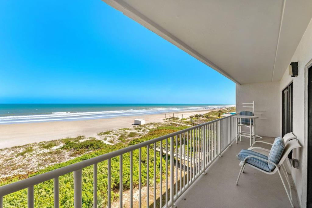a balcony with a view of the beach at Boardwalk 205 in Cocoa Beach
