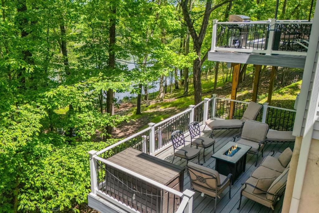 an aerial view of a deck with chairs and a table at Lakeview Retreat w Kayaks Game Room Firepits Gated Community w Lake Beach Access in East Stroudsburg