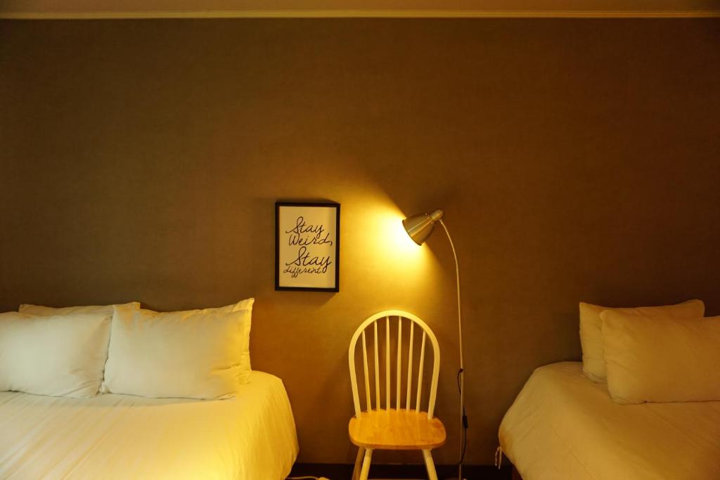 Postel nebo postele na pokoji v ubytování Grim Garden Guesthouse