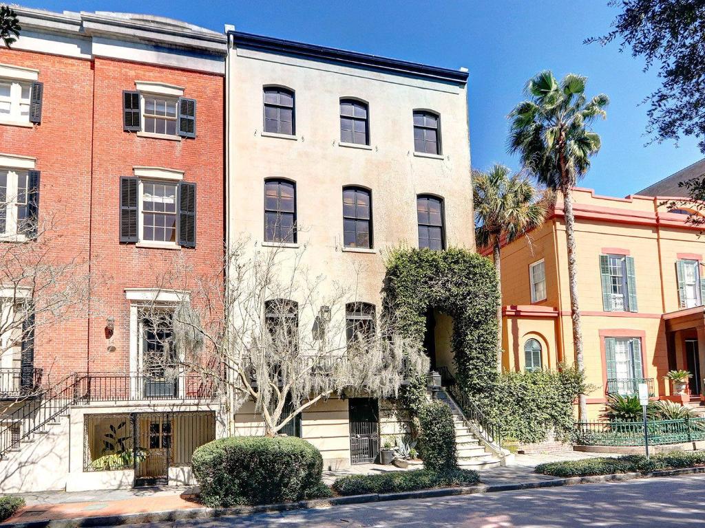 a large brick building with a tree in front of it at Elsewhere on Madison Square Manor in Savannah