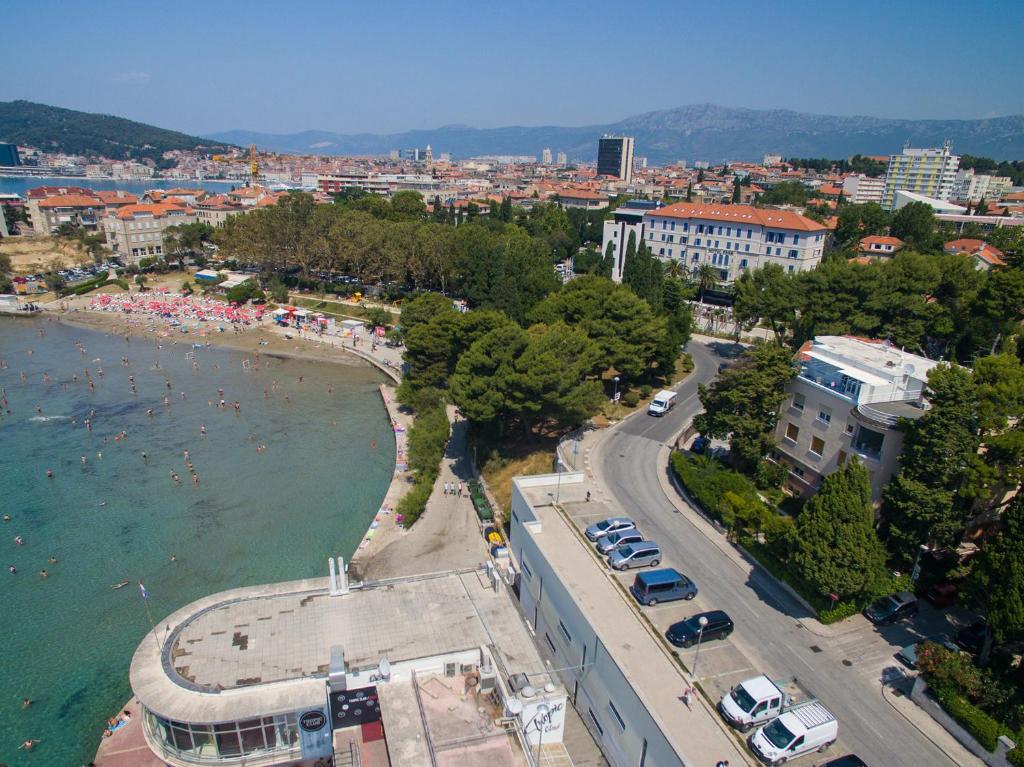 an aerial view of a city and a beach at Apartments Sand Beach in Split