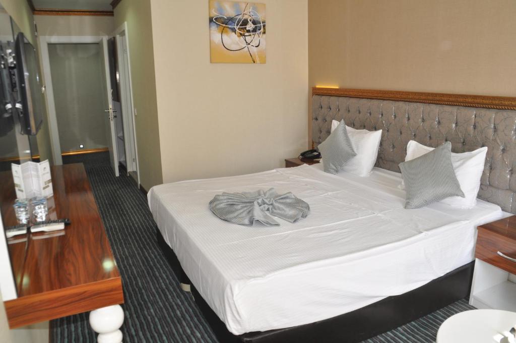 Postel nebo postele na pokoji v ubytování Grand Sera Hotel