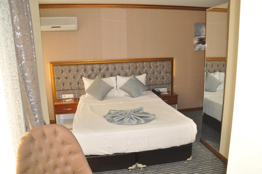 Postel nebo postele na pokoji v ubytování Grand Sera Hotel