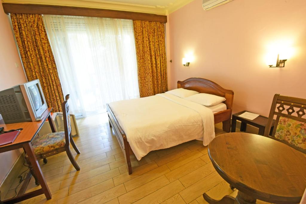 Imperial Golf View Hotel tesisinde bir odada yatak veya yataklar